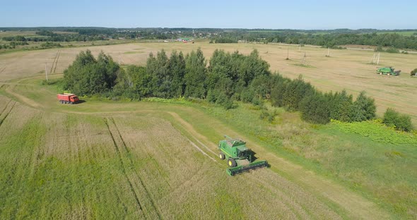 Combine Harvester on Wheat Field