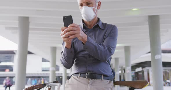 Caucasian man out and about in the street wearing on a face mask against coronavirus