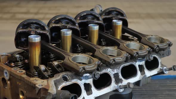Used Cylinder Head with Old Damage Pistons Isolated