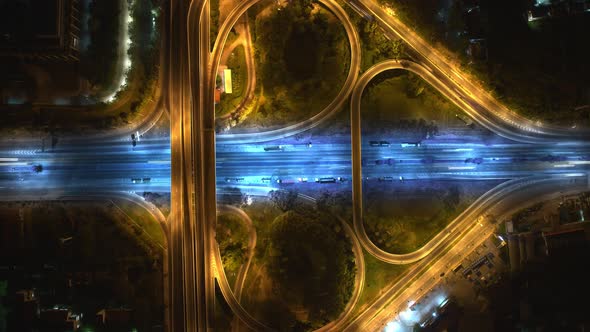 4K : Time lapse Aerial view and top view of traffic on city. Expressway with car lots