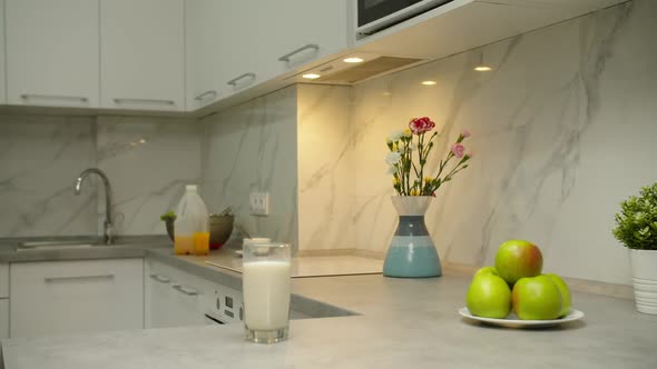 Black Boy Taking Glass of Milk Enjoying Taste of Fresh Dairy Indoors