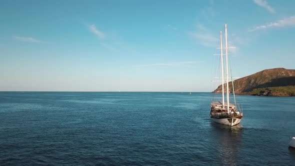 Aerial View on Sailing Boat with People on Board Near Lipari Islands, Sicily, Italy. Mediterranean