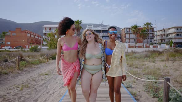 young women having fun on the beach