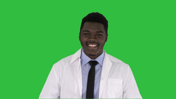 Afro-American Doctor Talking To Camera on a Green Screen