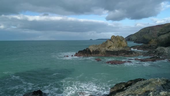 Aerial fly through of dramatic coastline, aerial POV style view