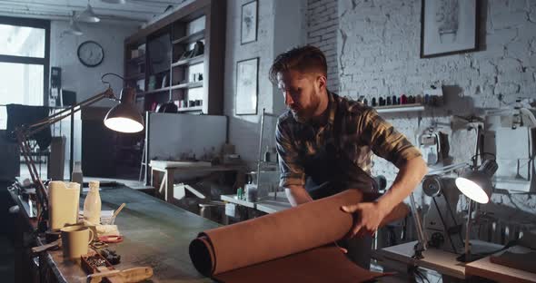 Male Artisan Preparing Leather for Work