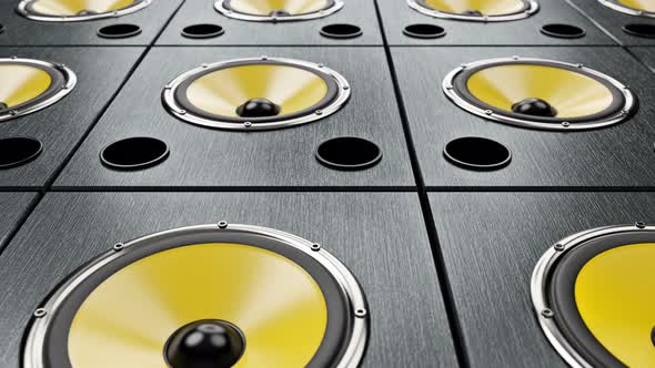 Moving Diagonal over Audio Speakers with Yellow Membranes Playing Modern Music