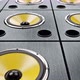 Moving Diagonal over Audio Speakers with Yellow Membranes Playing Modern Music - VideoHive Item for Sale