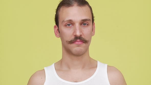 Slomo Skinny Mustached Man with Blue Eyes Showing Surprise and Expressing Lack of Information