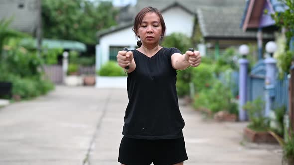 A young woman exercising with an elastic rope.Slow motion footage.