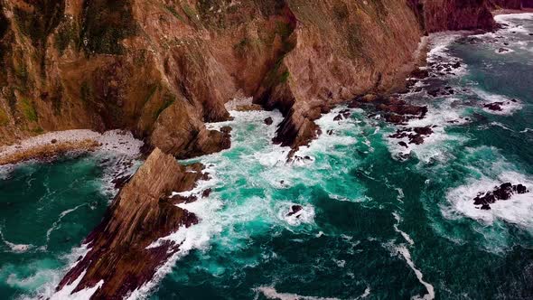 Huge Cliffs and Green Ocean on Coast Highway in Big Sur, Drone Reveal