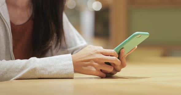 Using mobile phone in coffee shop