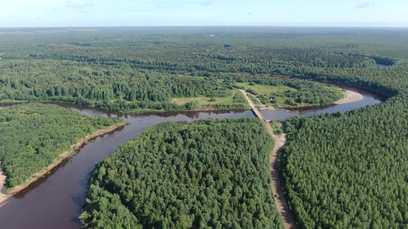 Forest River in the Summer Taiga From a Height of Flight