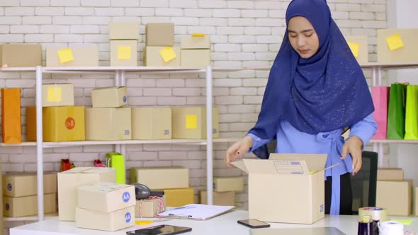A young Muslim woman who started a small business. freelance entrepreneur working from home
