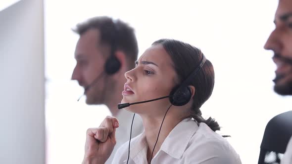 Contact Center. Woman Operator With Headache And Stress At Work