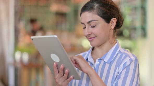 Young Indian Woman Using Digital Tablet