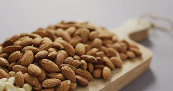 Video of almonds on wooden chopping board