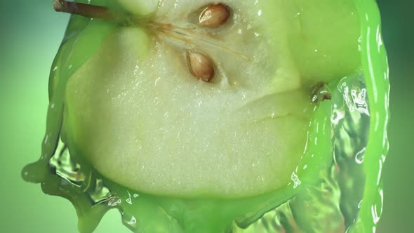 Flowing Green Apple Juice From Half Apple  Macro Shot in Slow Motion