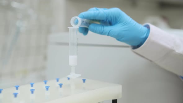 Scientist Purifies Extract Using Vaccum SPE Manifold