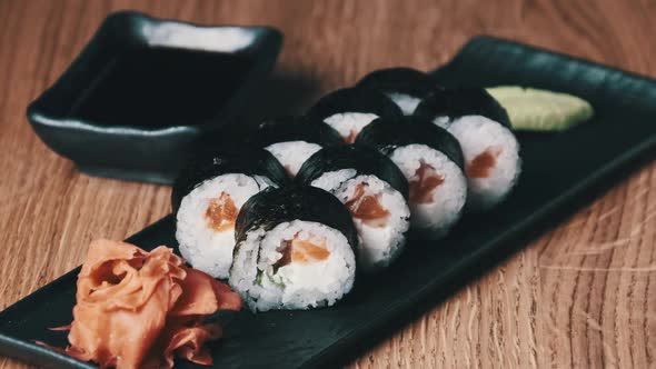 Sushi on a Wooden Table in Restaurant Delicious Japanese Food Sushi Rolls