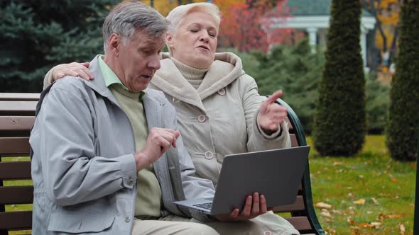 Happy Elderly Grandparents Couple Family Senior Man Husband and Middleaged Woman Wife Sit on Bench