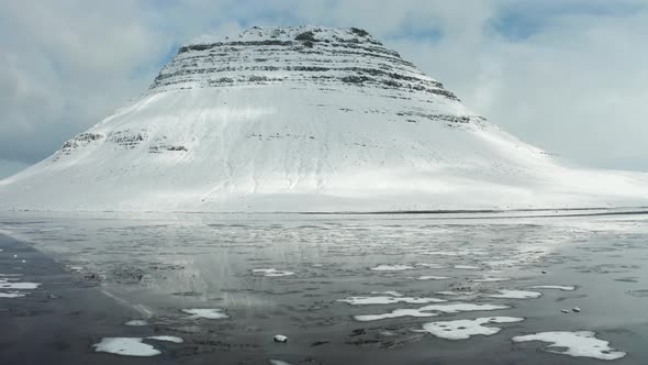 Bird's-eye View of the Snowy Mount Kirkjufetl. Iceland, Winter 2019.