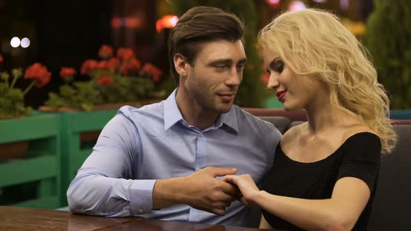 Couple in Love Spending Their Date on Open Terrace of Cozy Restaurant