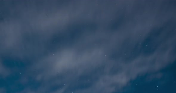 Dark Sky with Stars and Light White Clouds at Summer Night