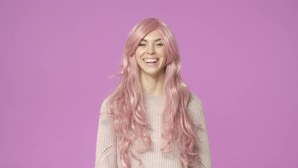 Slowmotion Cheerful Kawaii Adorable Woman in Pink Wig Smiling and Laughing Carefree Like Cosplay