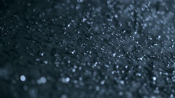 Super Slow Motion Shot of Water Splashing on Waterproof Cloth at 1000Fps