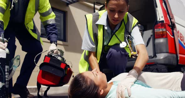 ambulance team treating a woman