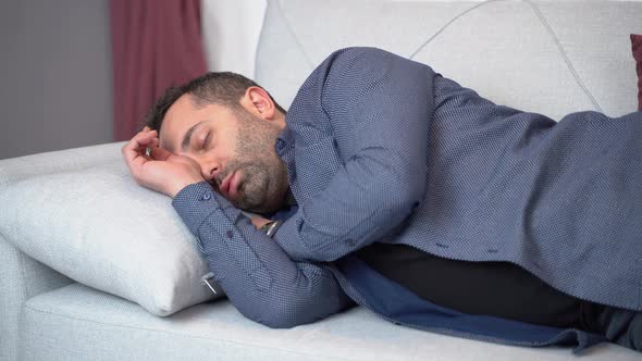 Man sleeping on sofa.