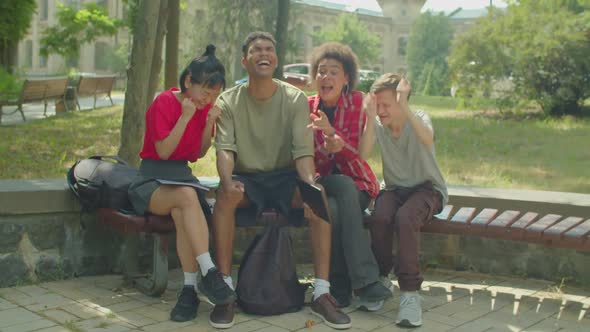 Joyful Diverse Multiethnic Students Celebrating Passing University Exam Outdoors
