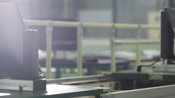 curved monitors are moved on a conveyor