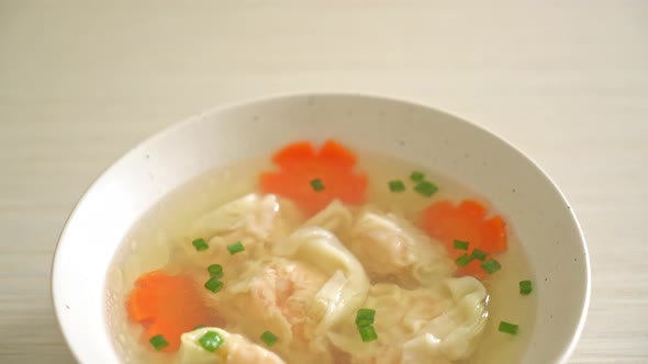 shrimp dumpling soup in white bowl - Asian food style