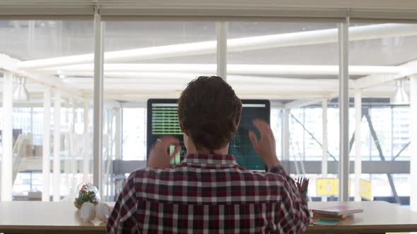 Young man working in a creative office