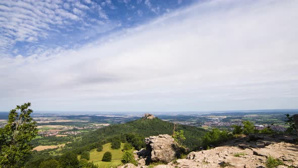 Timelapse image of clouds in the landscape, with Hohenzollern Castle (Swabian Alb, Germany). The hil