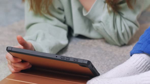 Girl Playing On Gadget