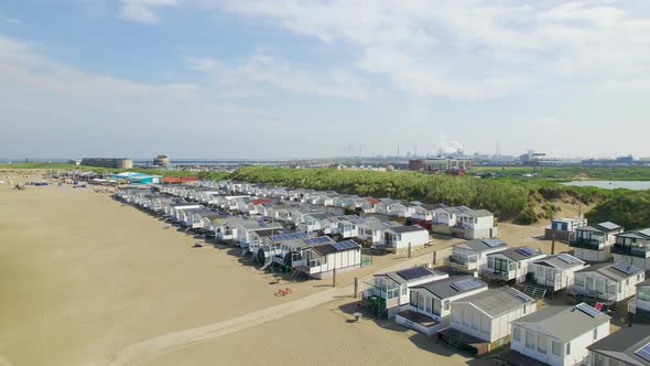 Rising aerial view over rows of beach houses in Netherlands