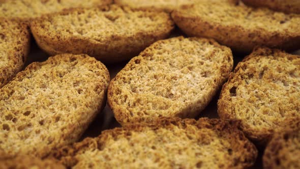 A pile of hard rusks from dark dry bread close up