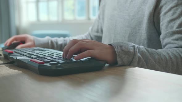 Close Up Of Hands Man Typing On Desktop Computer While Working At Home