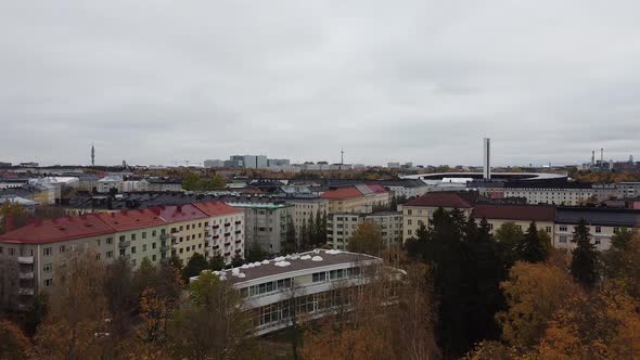 Aerial - Töölö Library and Helsinki Olympic Stadium, Finland, wide shot forward