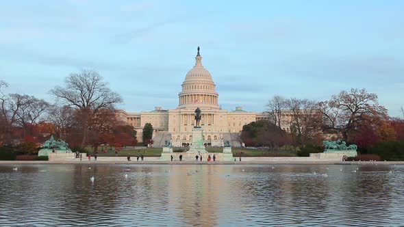 A static shot of the U.S. Capitol during the day.