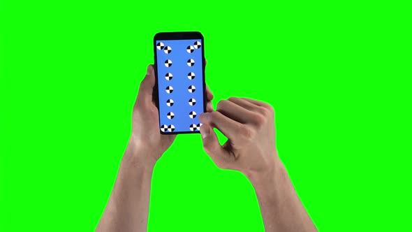 Man Holds Mobile Phone with Tracking Markers and Sliding Pages on a Green Screen Background