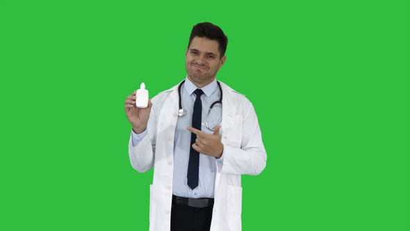 Doctor physician presenting medicine on a Green Screen, Chroma Key