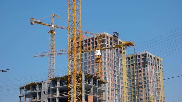 Modern Building Under Construction Against Blue Sky alt