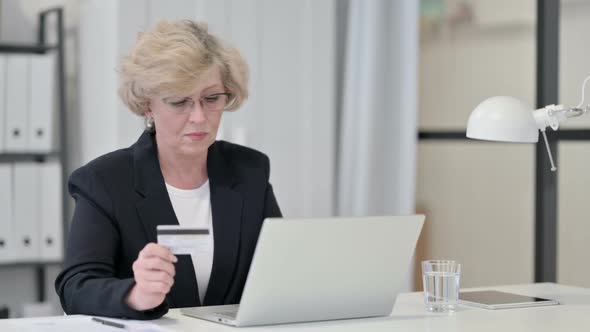 Old Businesswoman Having Online Shopping Failure on Laptop