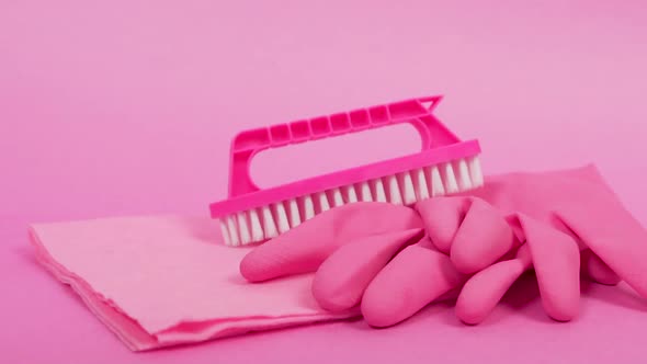 Closeup of a Duster Rubber Gloves and a Brush