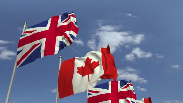 Row of Waving Flags of Canada and the United Kingdom