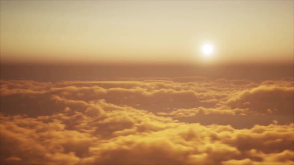 Flight through clouds in evening or morning alt